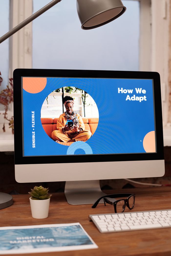 Mastering the First Impression: Your intriguing post title goes here Creative office setup with a desktop computer displaying a vibrant design.